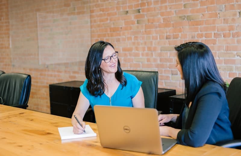Two professionals reviewing a client's plan together