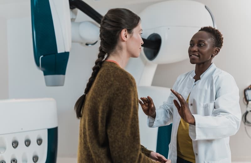 A physician talking through a diagnosis with a patient