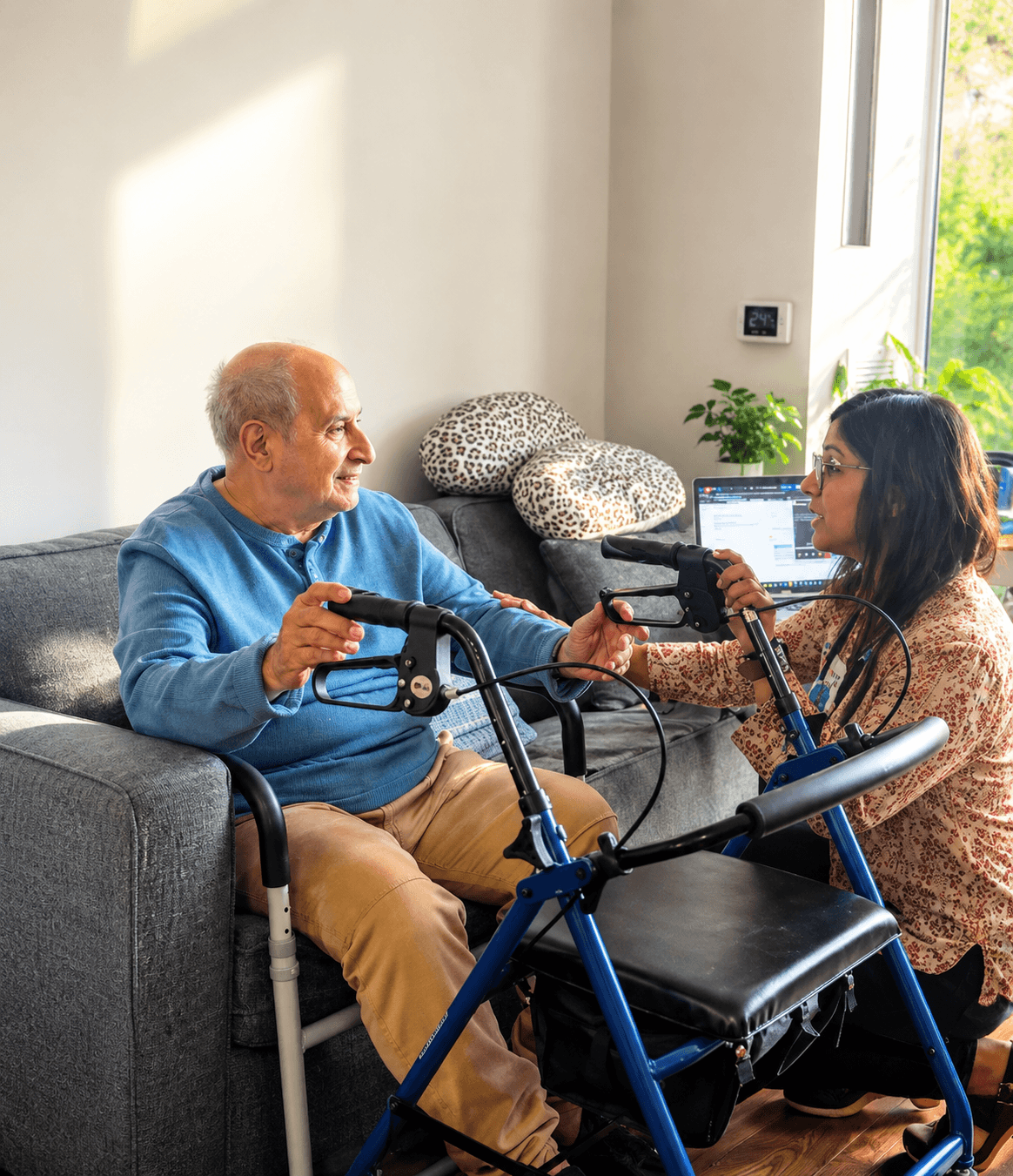 Subarna Mukherjee, RN, sharing a warm moment with an elderly client